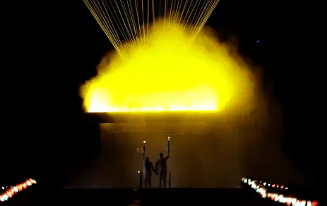 Paris 2024 Olympics - Opening Ceremony - Paris, France - July 26, 2024. Torchbearers Teddy Riner and Marie-Jose Perec light the Olympic cauldron during the opening ceremony. REUTERS/Ueslei Marcelino