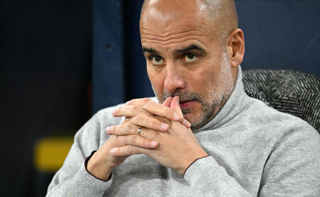 Pep Guardiola, técnico do Manchester City (foto: OLI SCARFF/AFP)